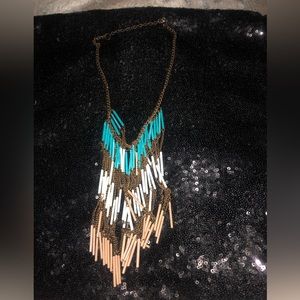 Brown chain with 3 different color;  white, brown, turquoise.